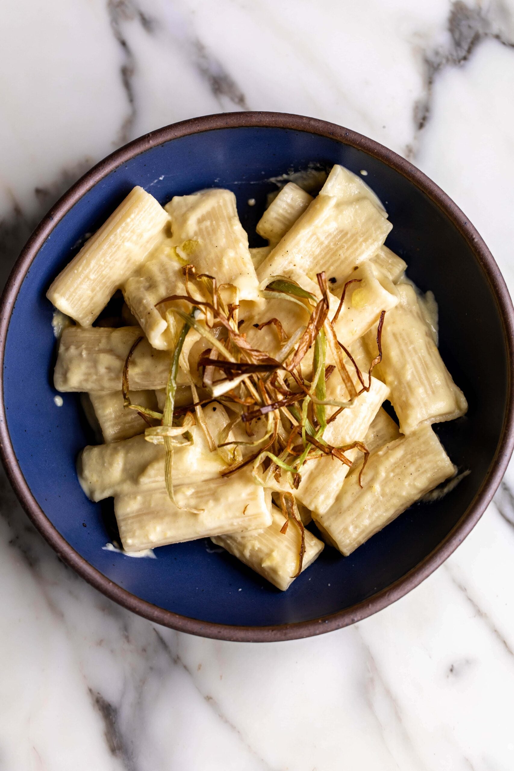 creamy corn pasta with frizzled leeks and truffle summer pasta dish.