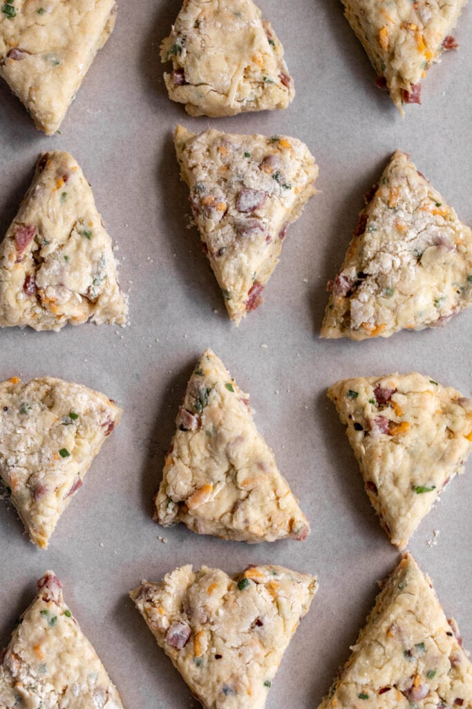 scones cut into triangles on baking sheet.