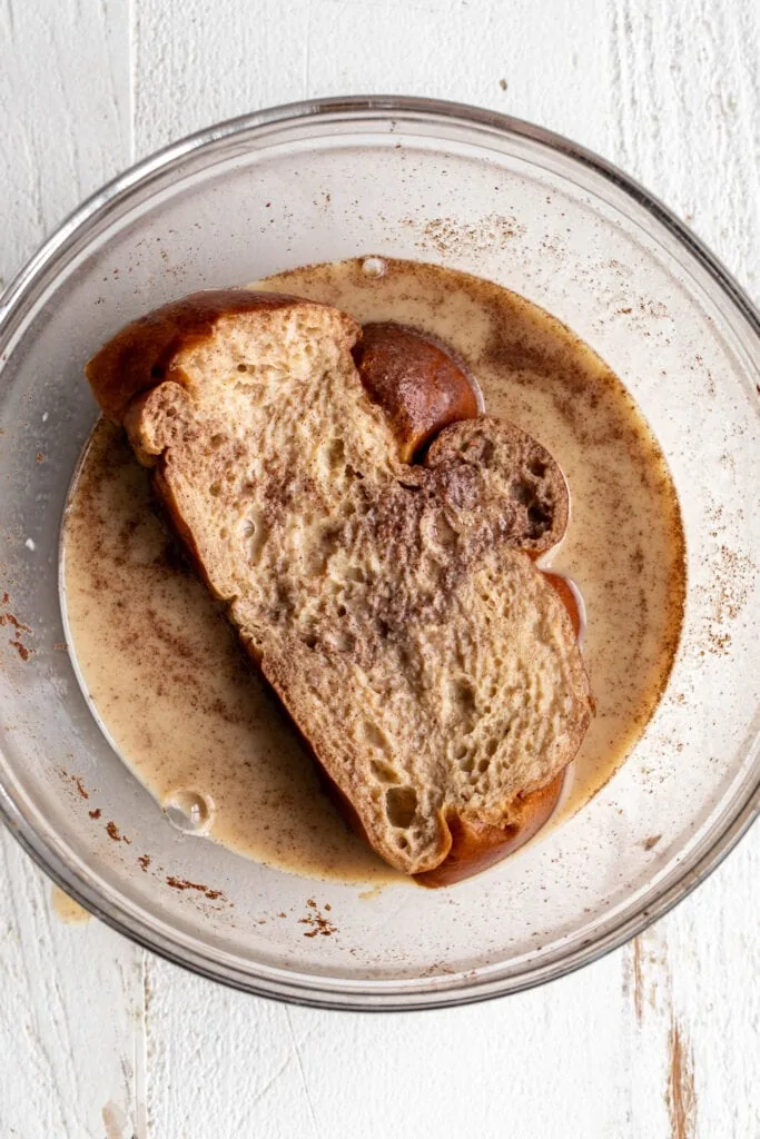 challah bread soaked in custard mixture with eggs and milk