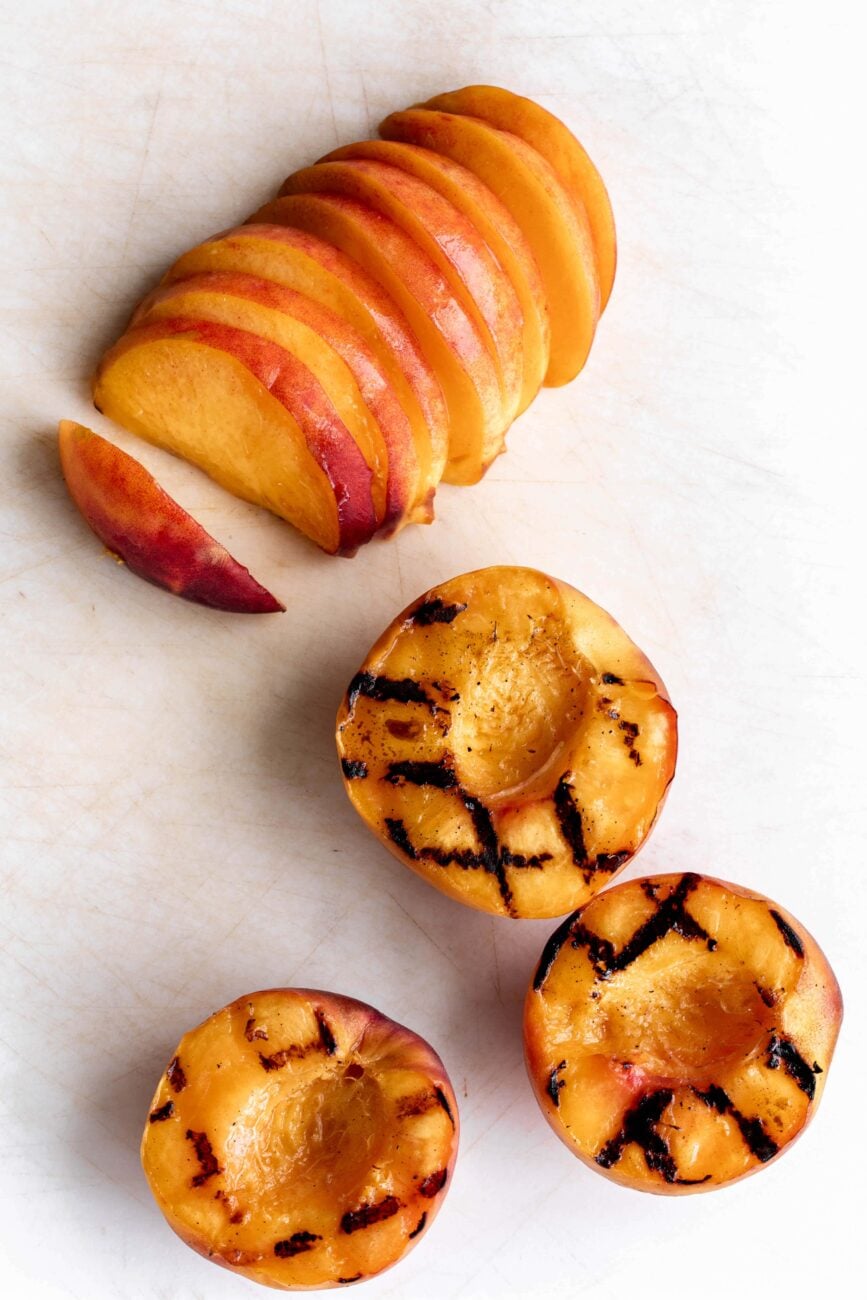 grilled peach halves and slices.