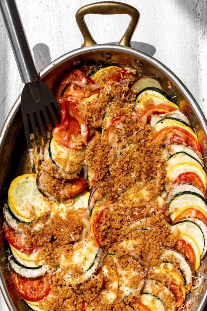 ratatouille gratin baked golden brown with spatula serving