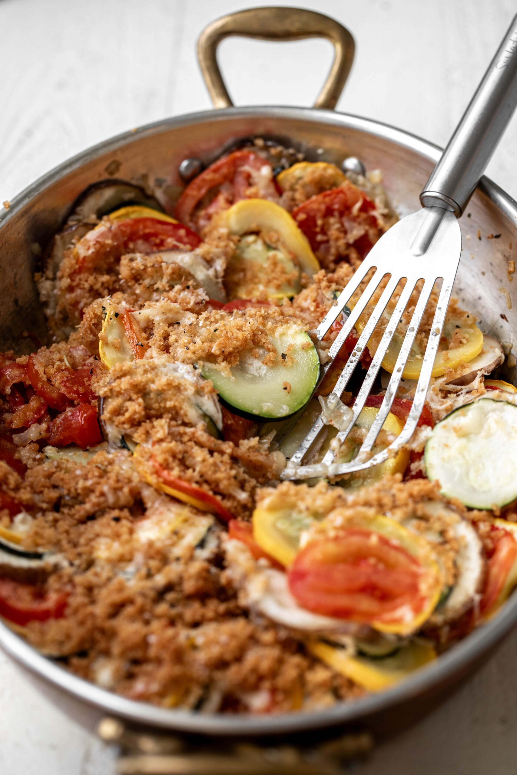 ratatouille gratin with breadcrumbs, gruyere and parmesan cheese.