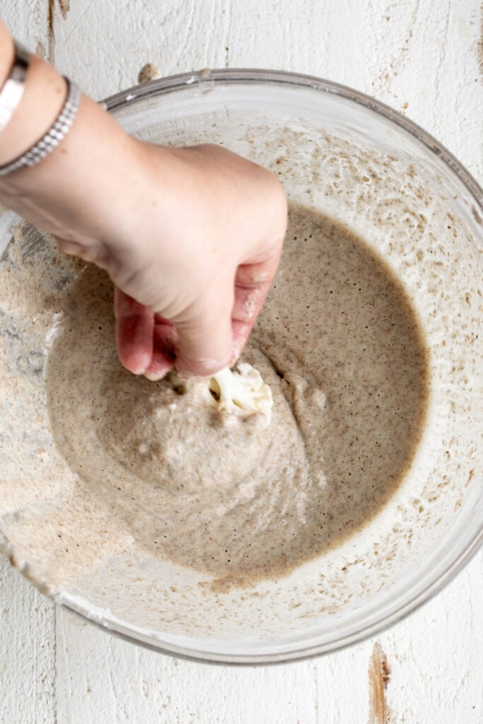 cauliflower floret dipped in batter.
