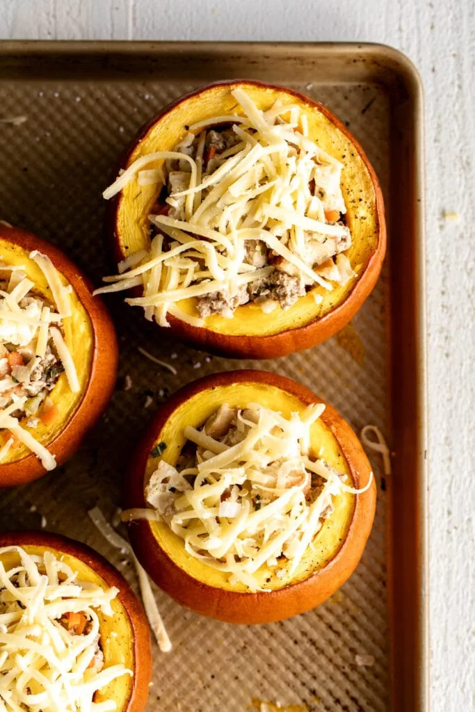 filled roasted mini pumpkins with the stuffing mixture topped with gruyere cheese