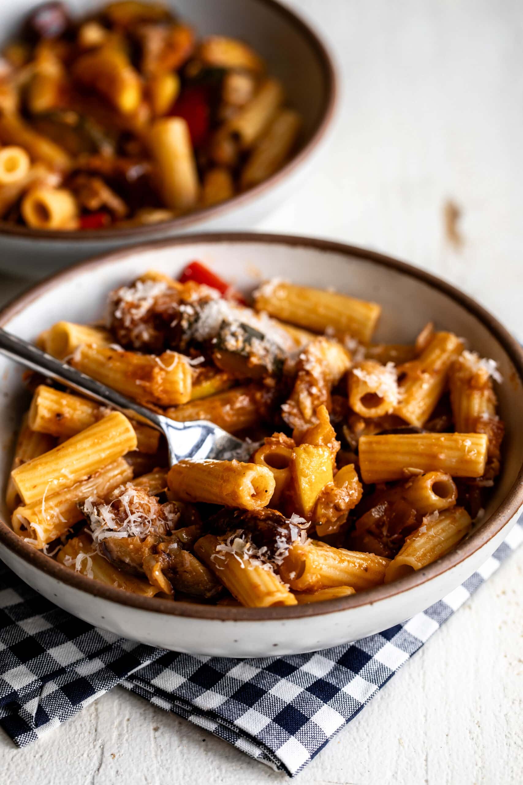 ratatouille rigatoni pasta with vegetables in bowl.