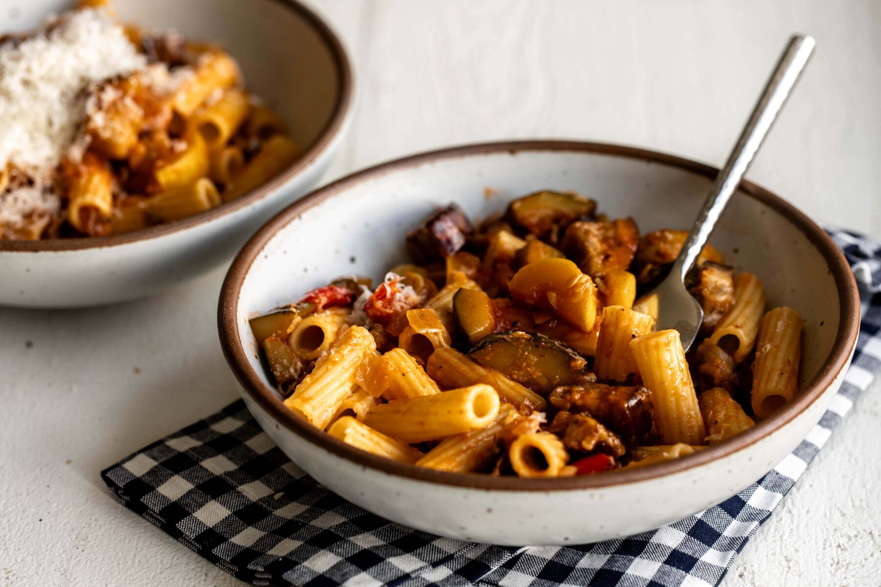 ratatouille rigatoni pasta with vegetables in bowl.