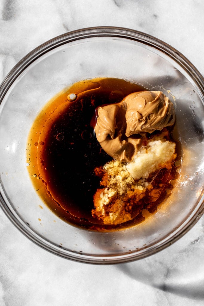 peanut sauce in glass mixing bowl.