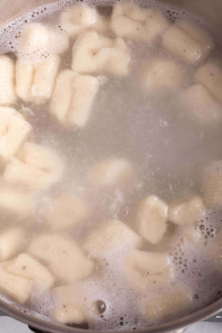cooked gnocchi in pot.