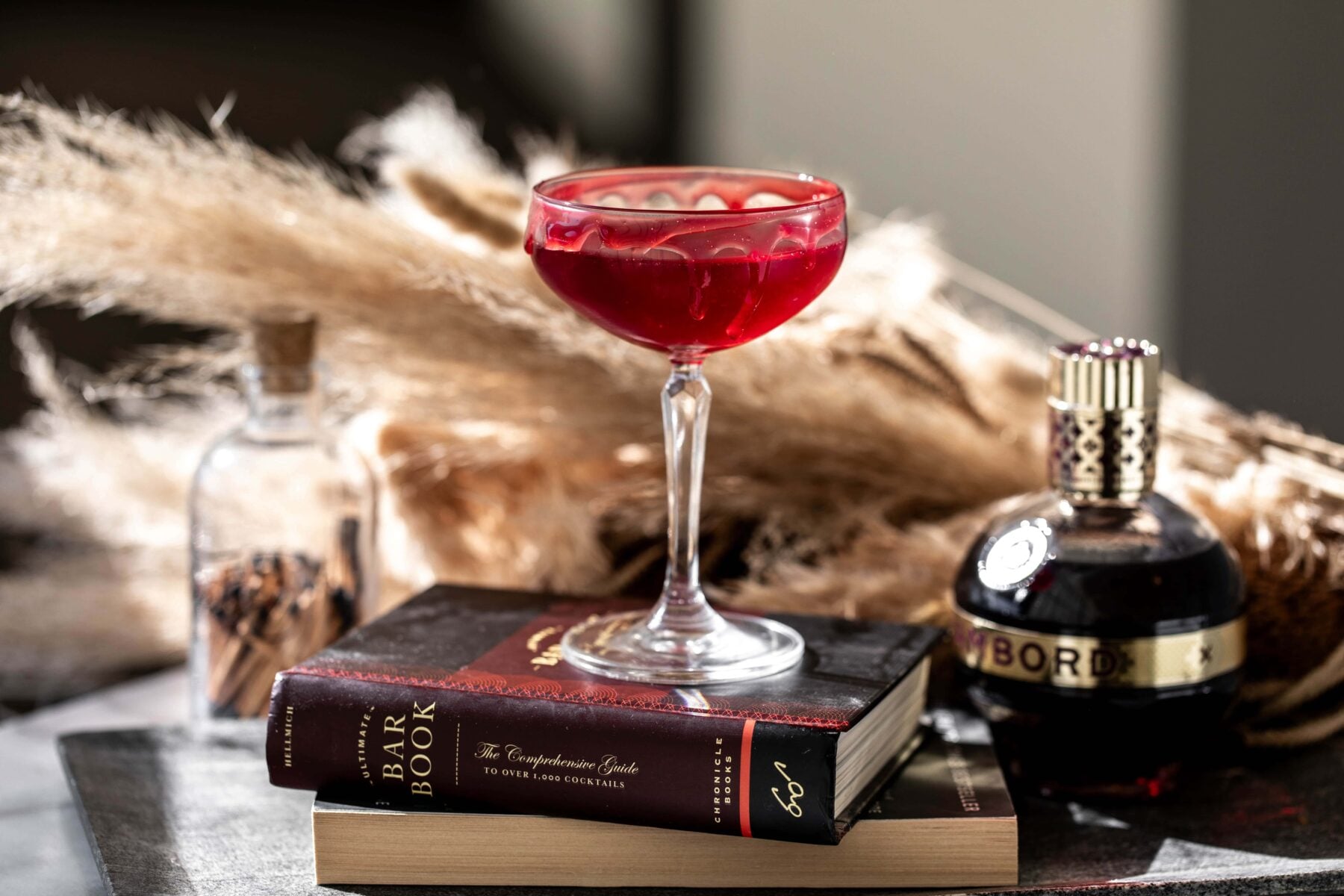 Vampire kiss halloween cocktail with red gel garnish.