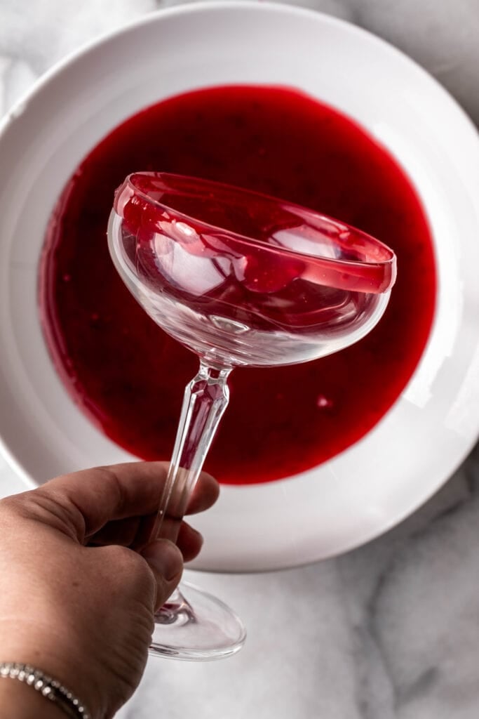 glass with cornstarch and cranberry juice for Vampire\'s Kiss Cocktail.