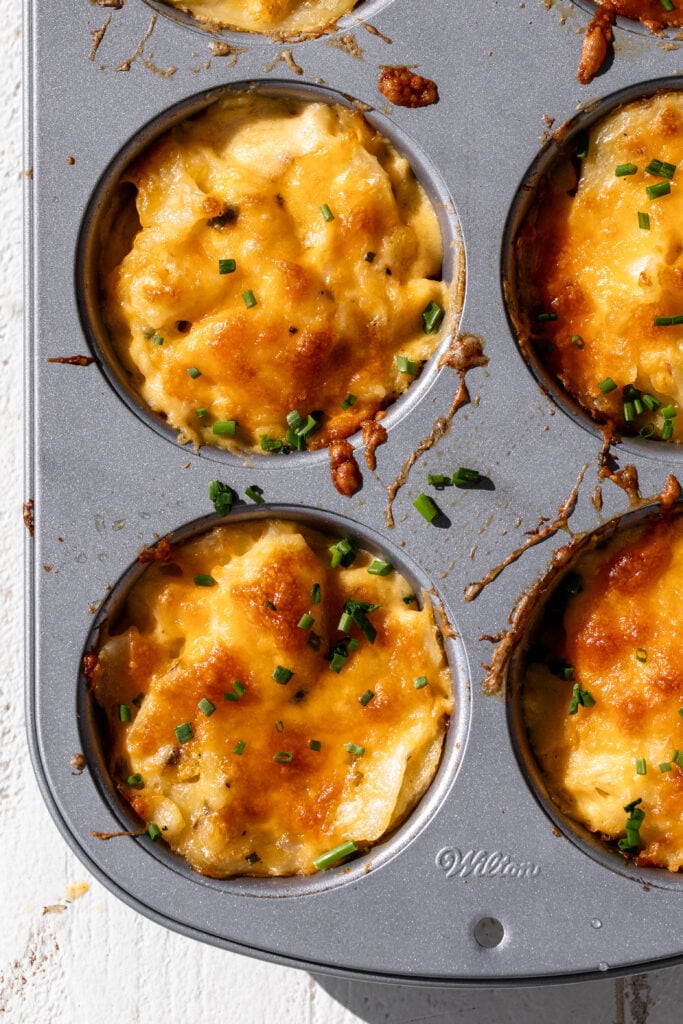 individual cheater cheesy au gratin potatoes in muffin tin.