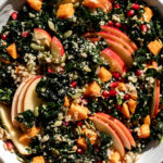 kale harvest grain bowl quinoa with apple slices.