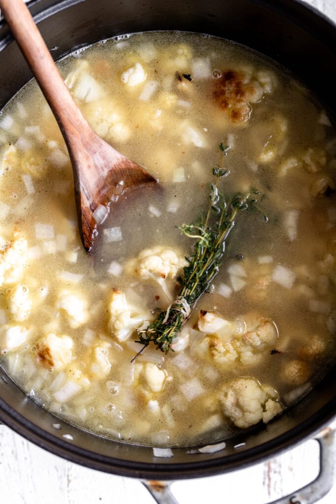 simmered cauliflower in broth with thyme.