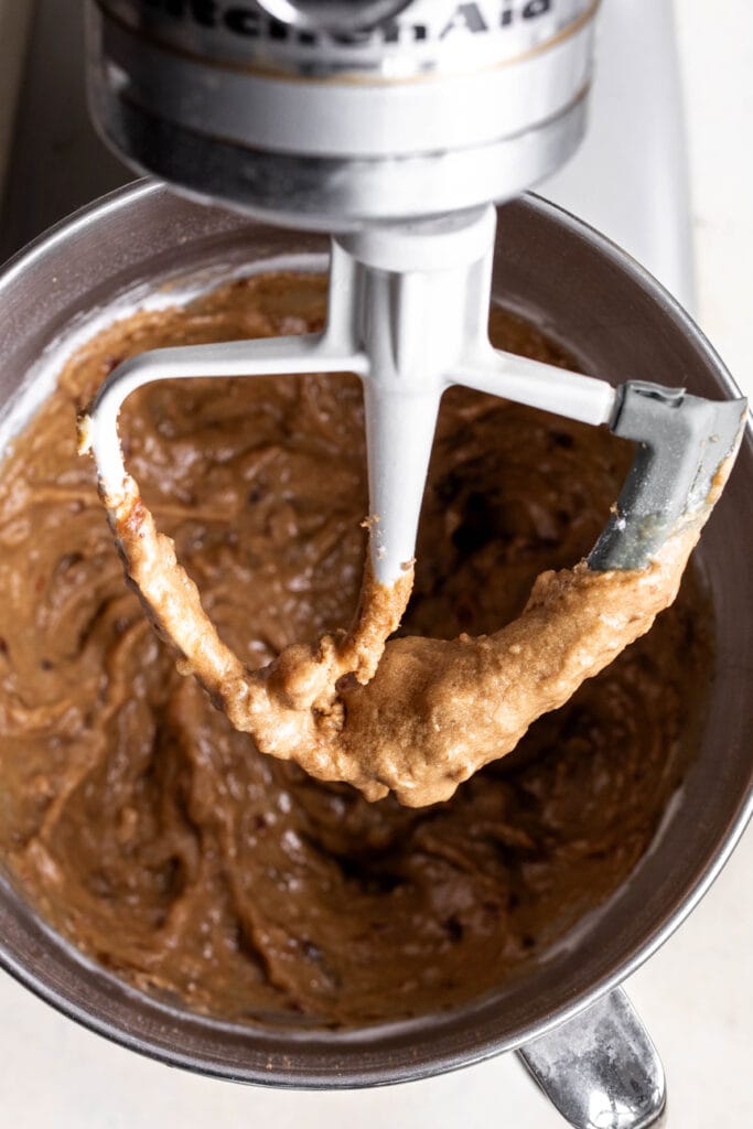 combined ingredients date cake batter in stand mixer.