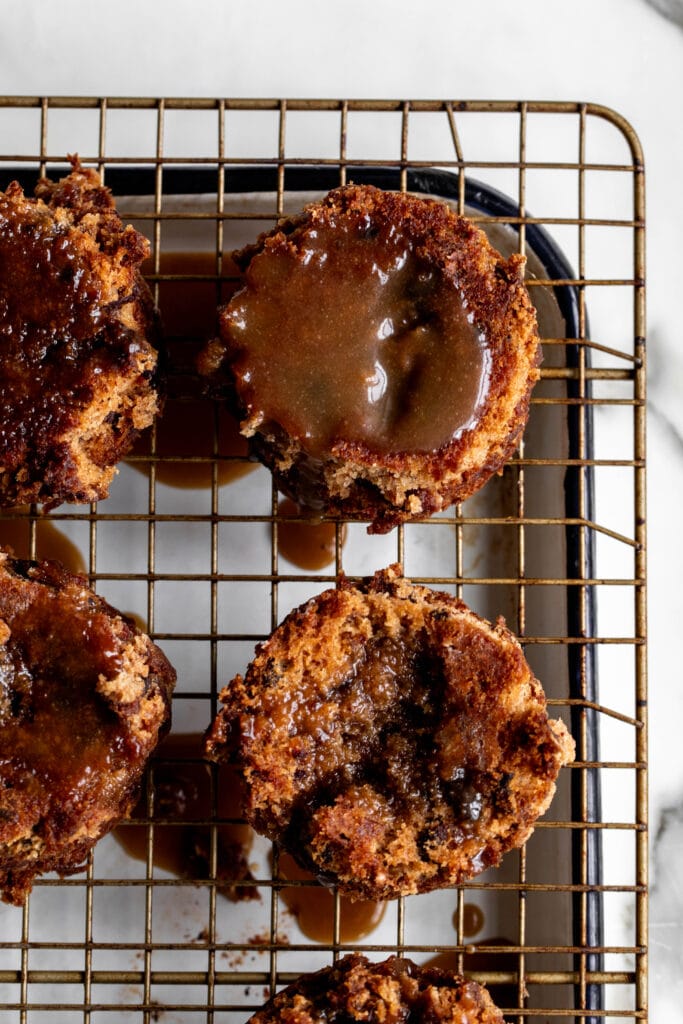 turned out date cakes on wire cooling rack with sticky toffee sauce.