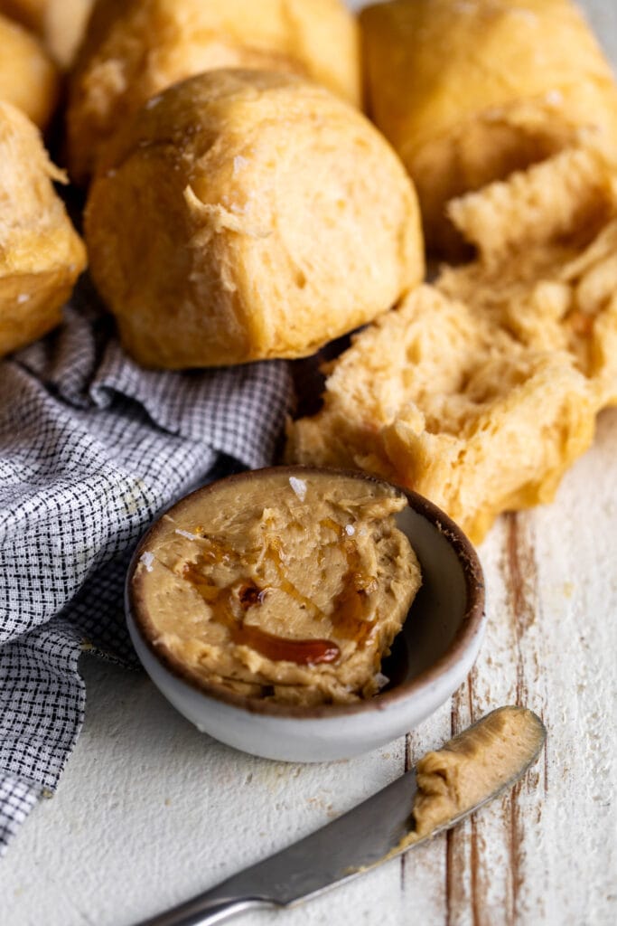 baked pull apart sweet potato dinner rolls with whipped cane sugar butter.