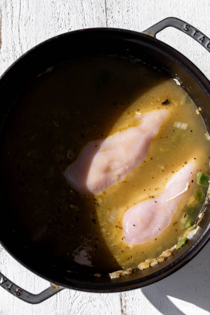 cooked chicken breasts in broth.