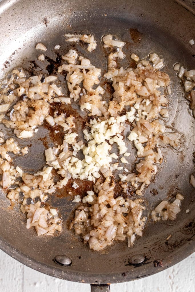 sautéed shallots and garlic in pan.
