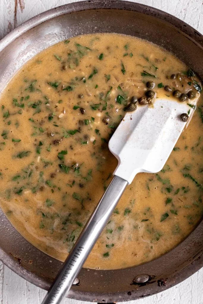 deglazed pan and emulsified butter sauce with capers.