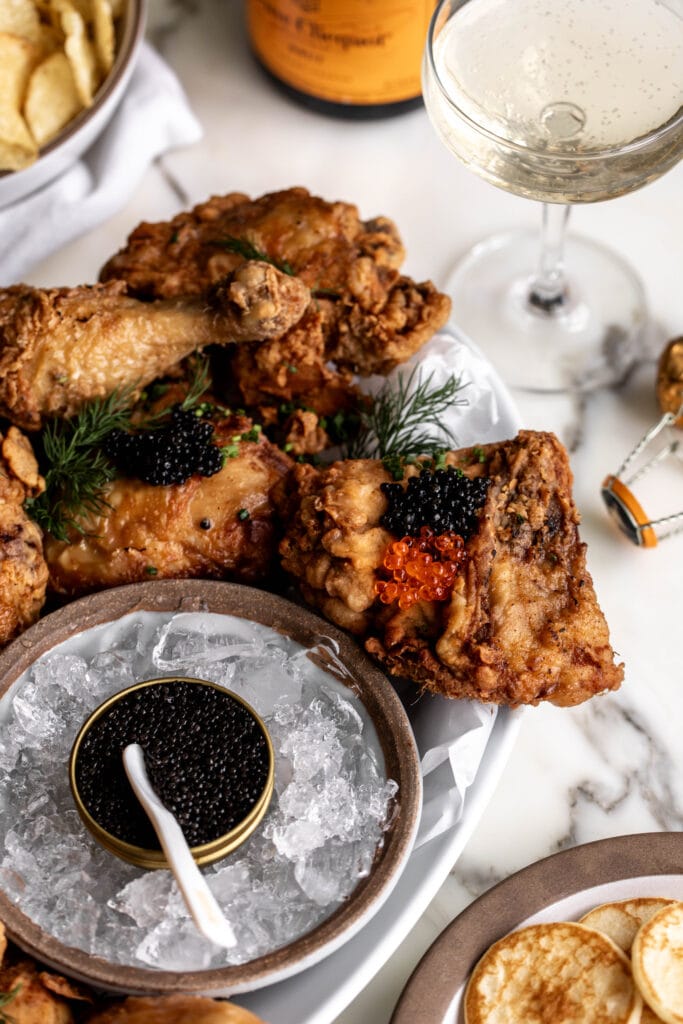 homemade fried chicken topped with spoonfuls of caviar and salmon roe.