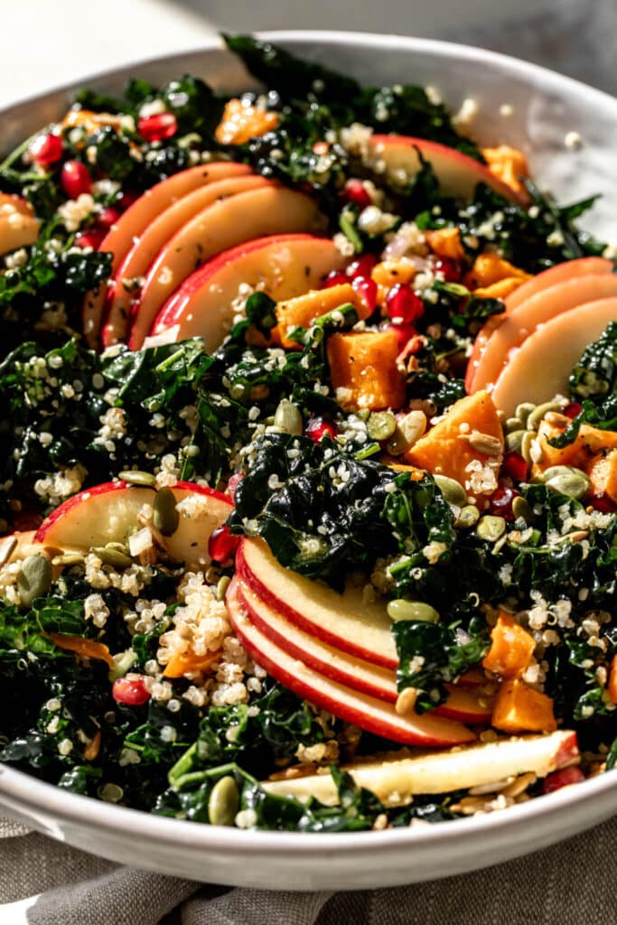 Kale Harvest Grain Bowl with apple slices.