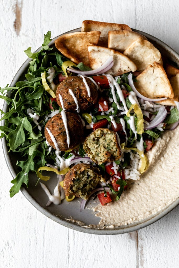 Falafel Bowl with “Tabbouleh” Rice hummus and arugula.