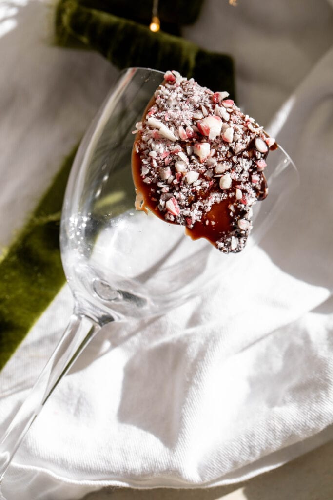 crushed candy cane garnished glass for Peppermint Martini.