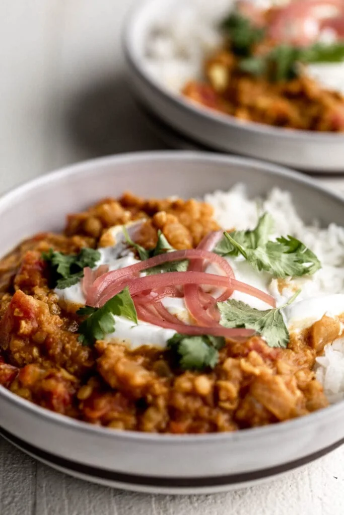 Red Lentil Dal (Masoor Dal) with yogurt and pickled onions.