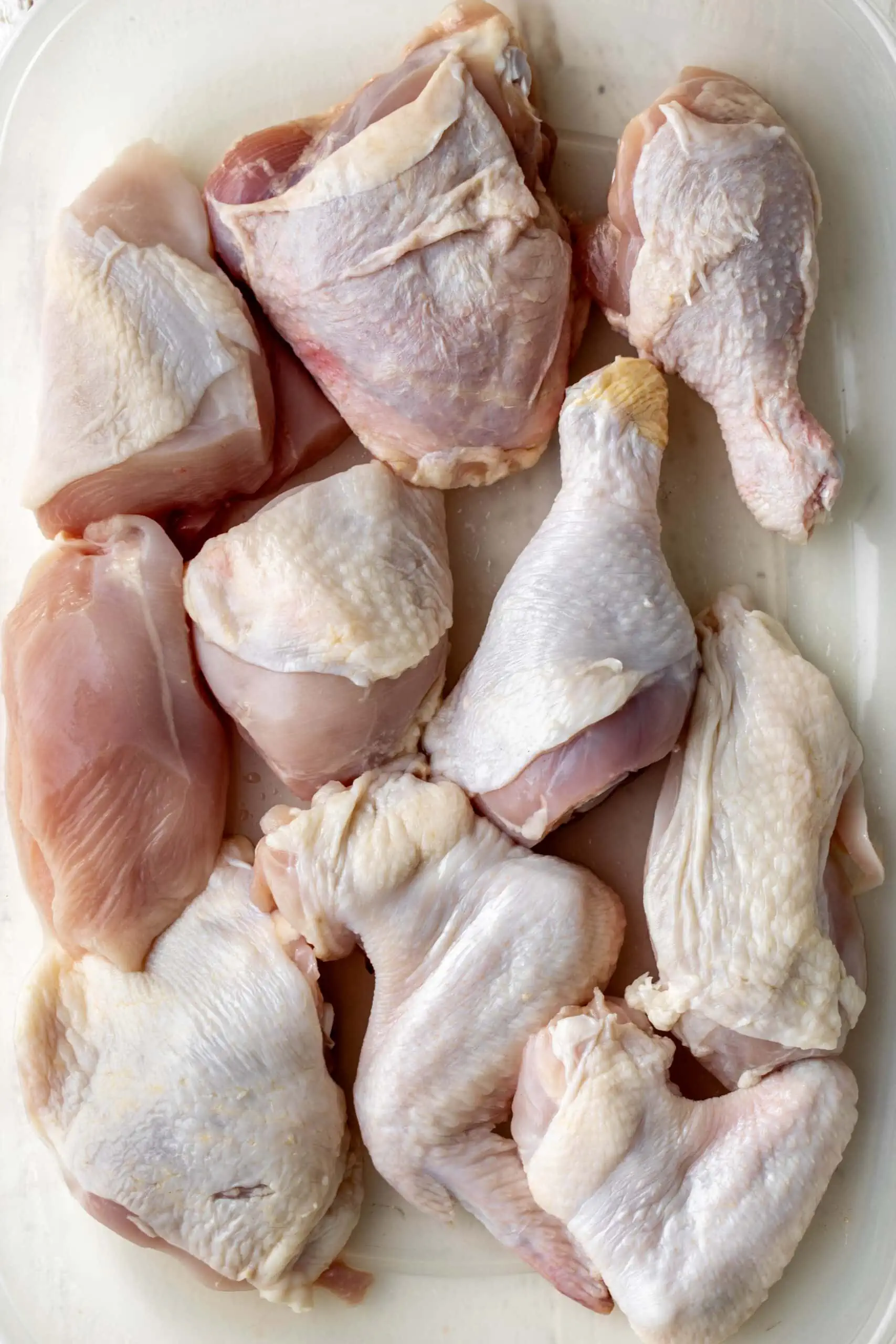raw chicken for Brined Fried Chicken cut into pieces.