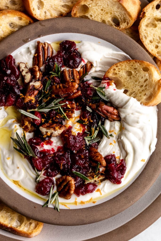 whipped goat cheese with cranberries pecans and rosemary with crostini.