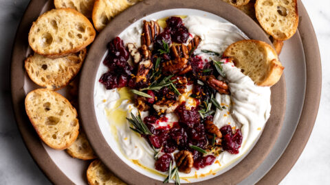 whipped goat cheese with cranberries pecans and rosemary with crostini.
