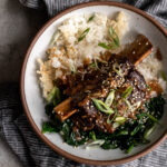 Braised miso ginger short ribs over crispy rice and sautéed spinach.