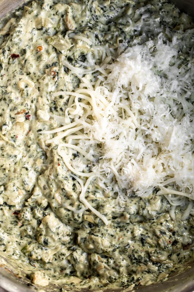 cooked spinach and artichokes with cream cheese and cheese.