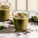 mint chocolate chip smoothie topped with cacao nibs.