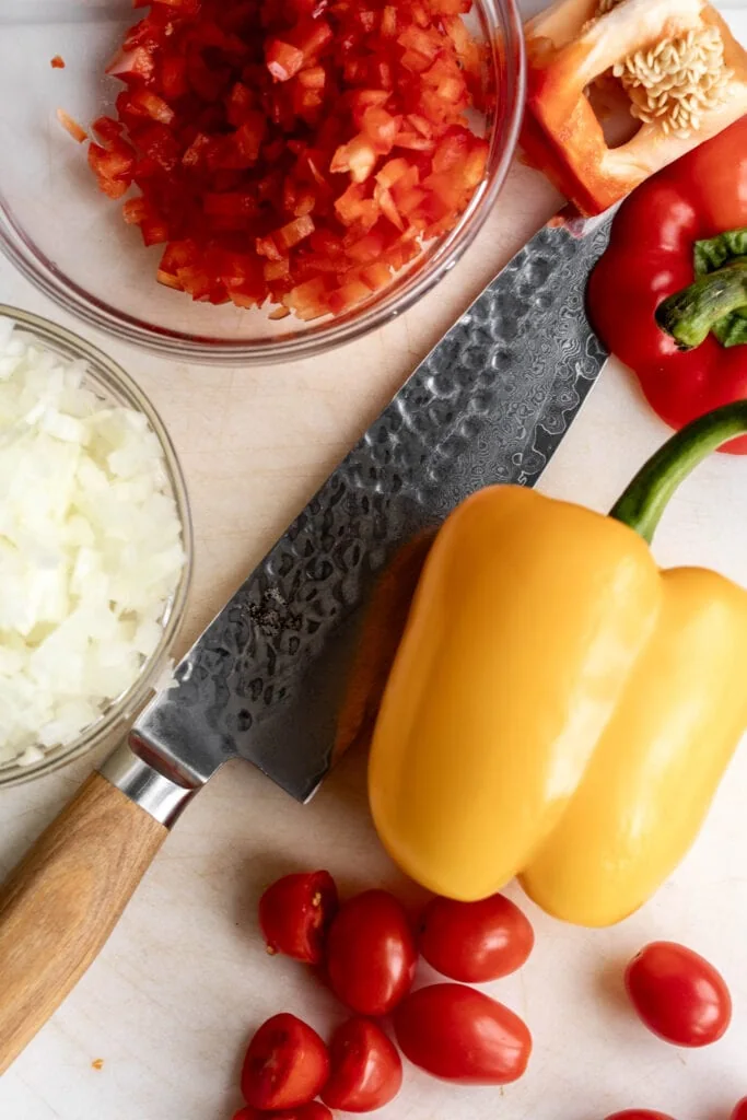 red and yellow bell peppers with diced yellow onion.