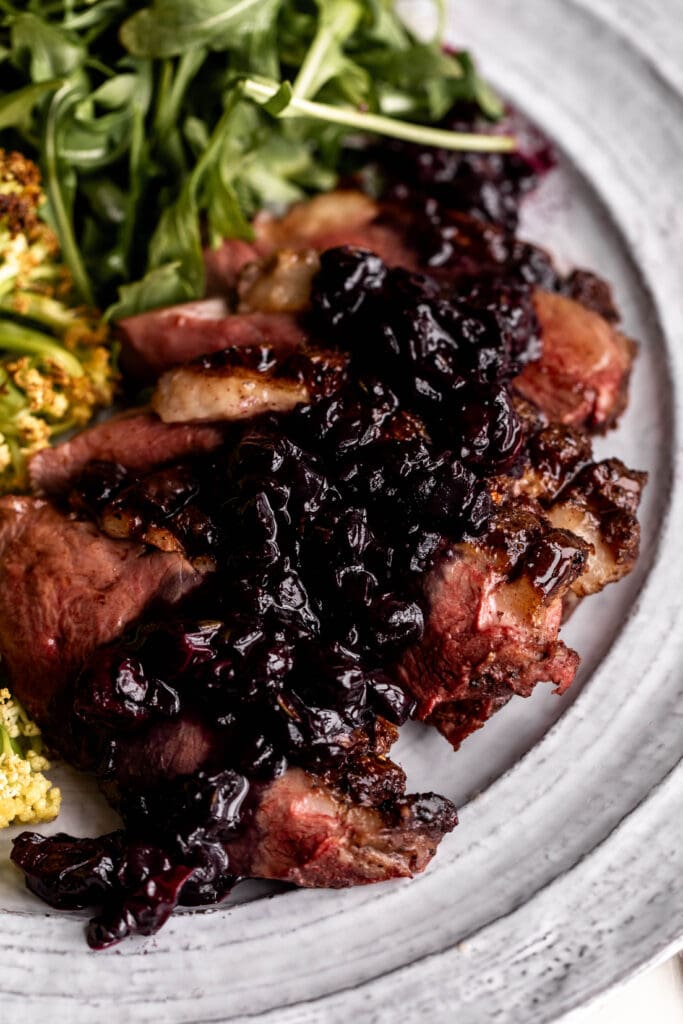 seared duck breast with blueberry pan sauce.