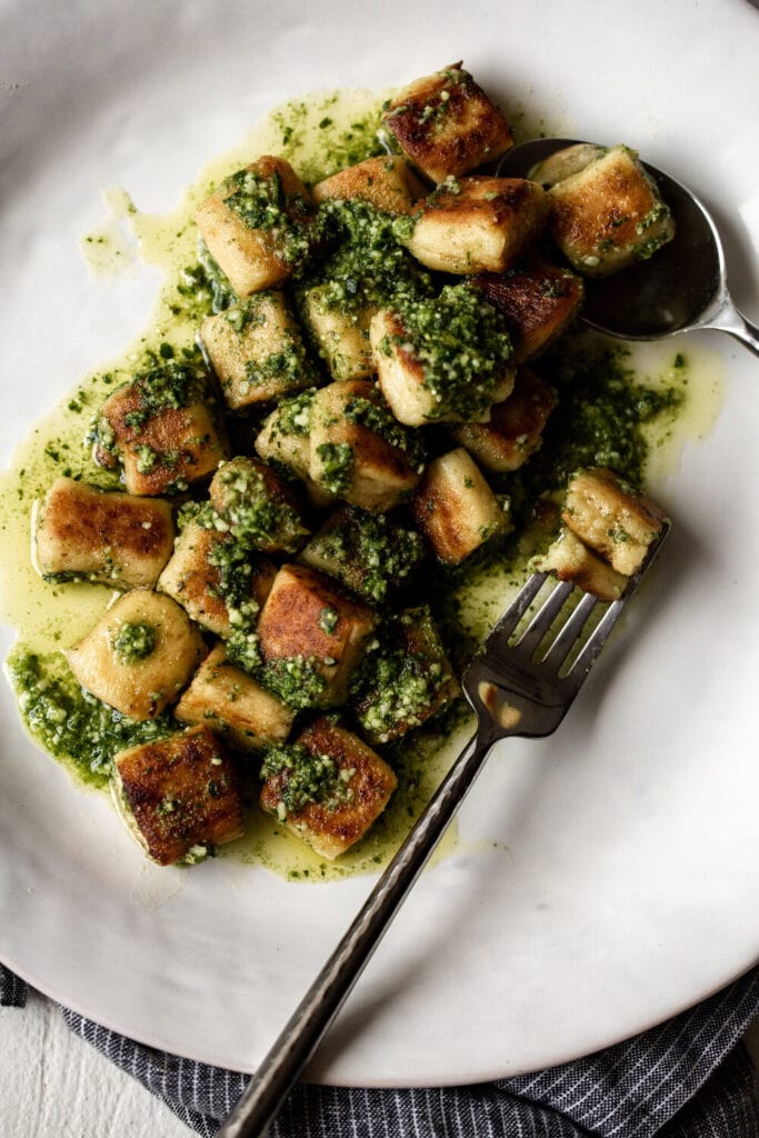 pan-fried ricotta gnocchi in pesto sauce.