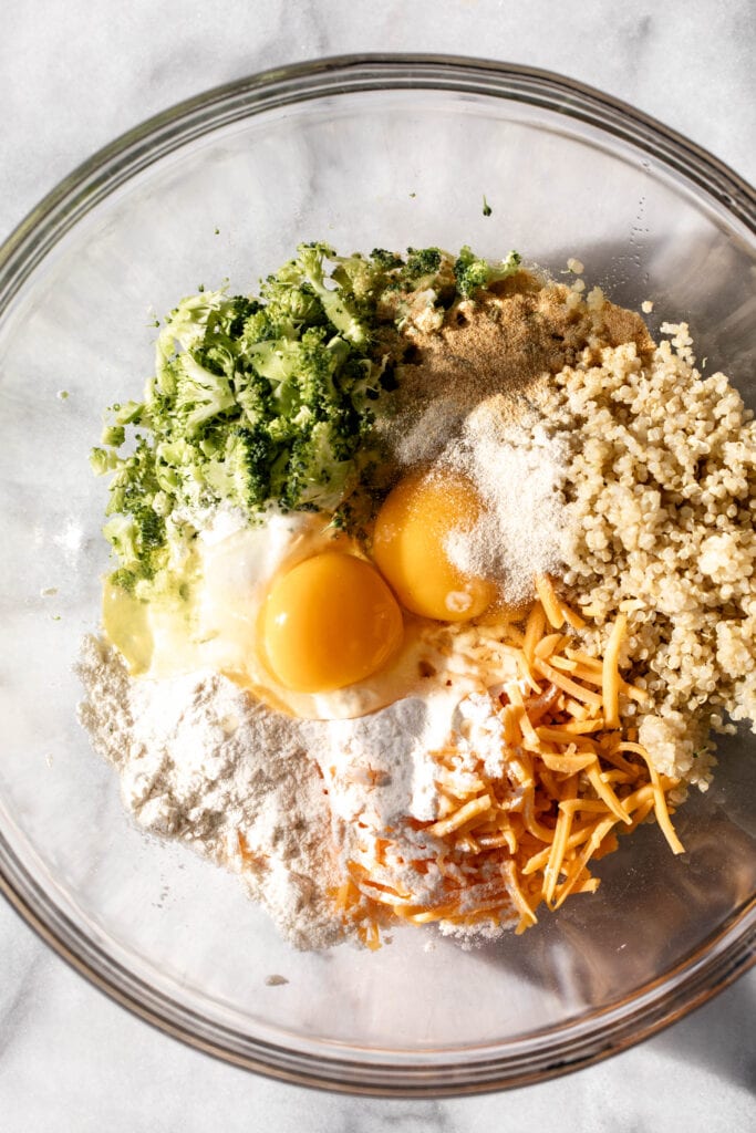 how to make broccoli cheddar quinoa bites ingredients in mixing bowl.