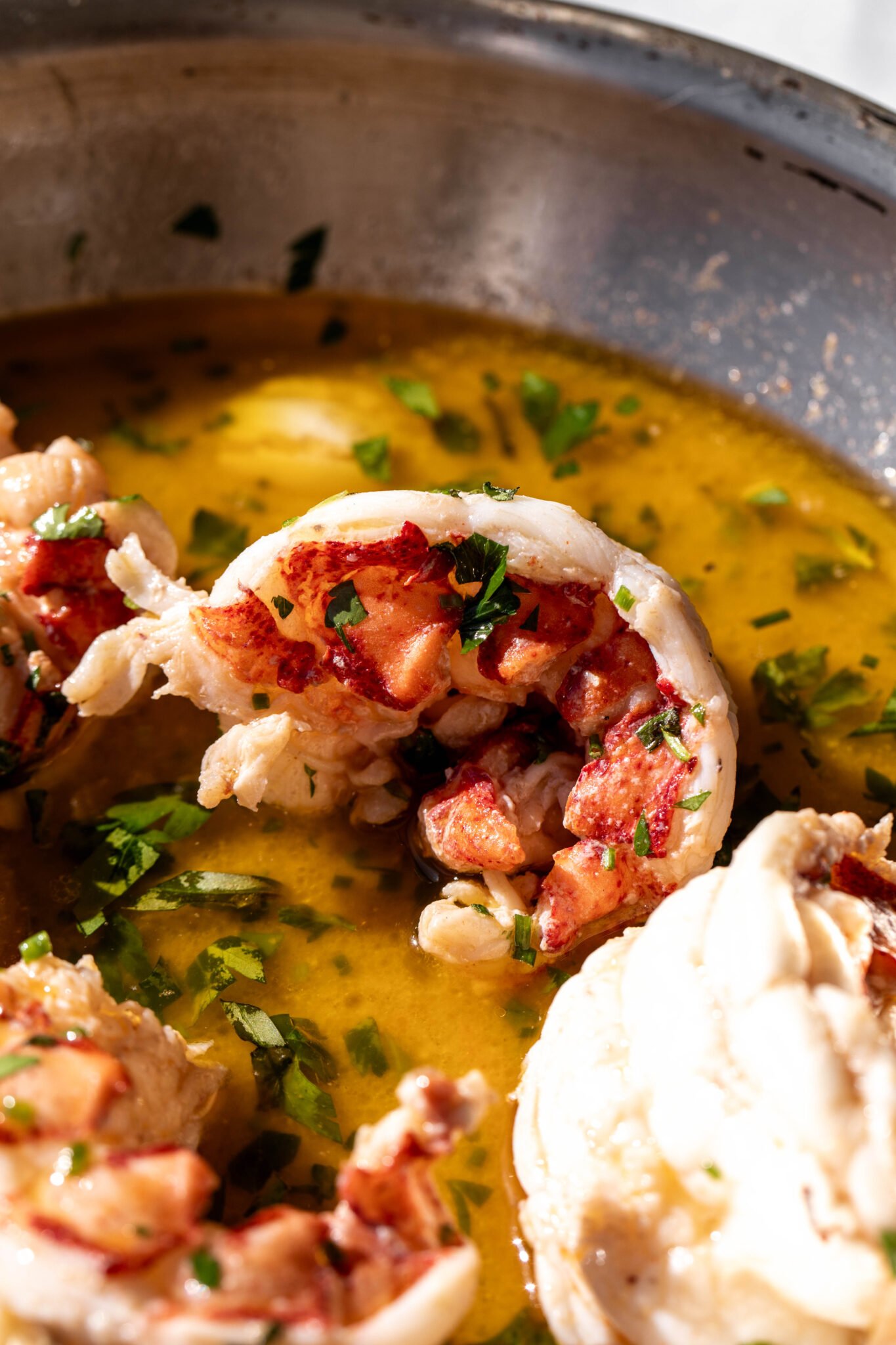 butter-poached-lobster-tails-cooking-with-cocktail-rings