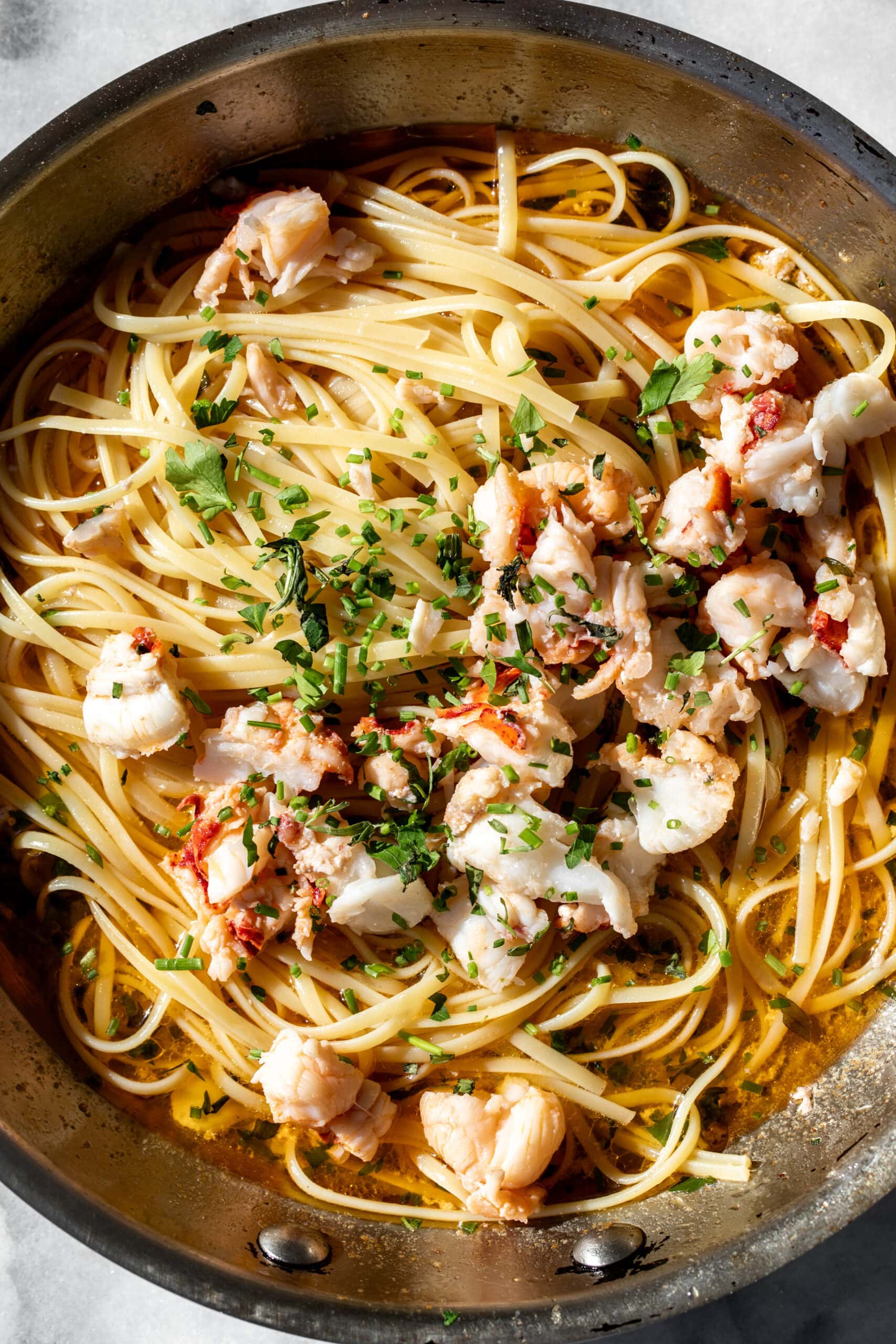 Butter Poached Lobster Tails with linguine pasta.