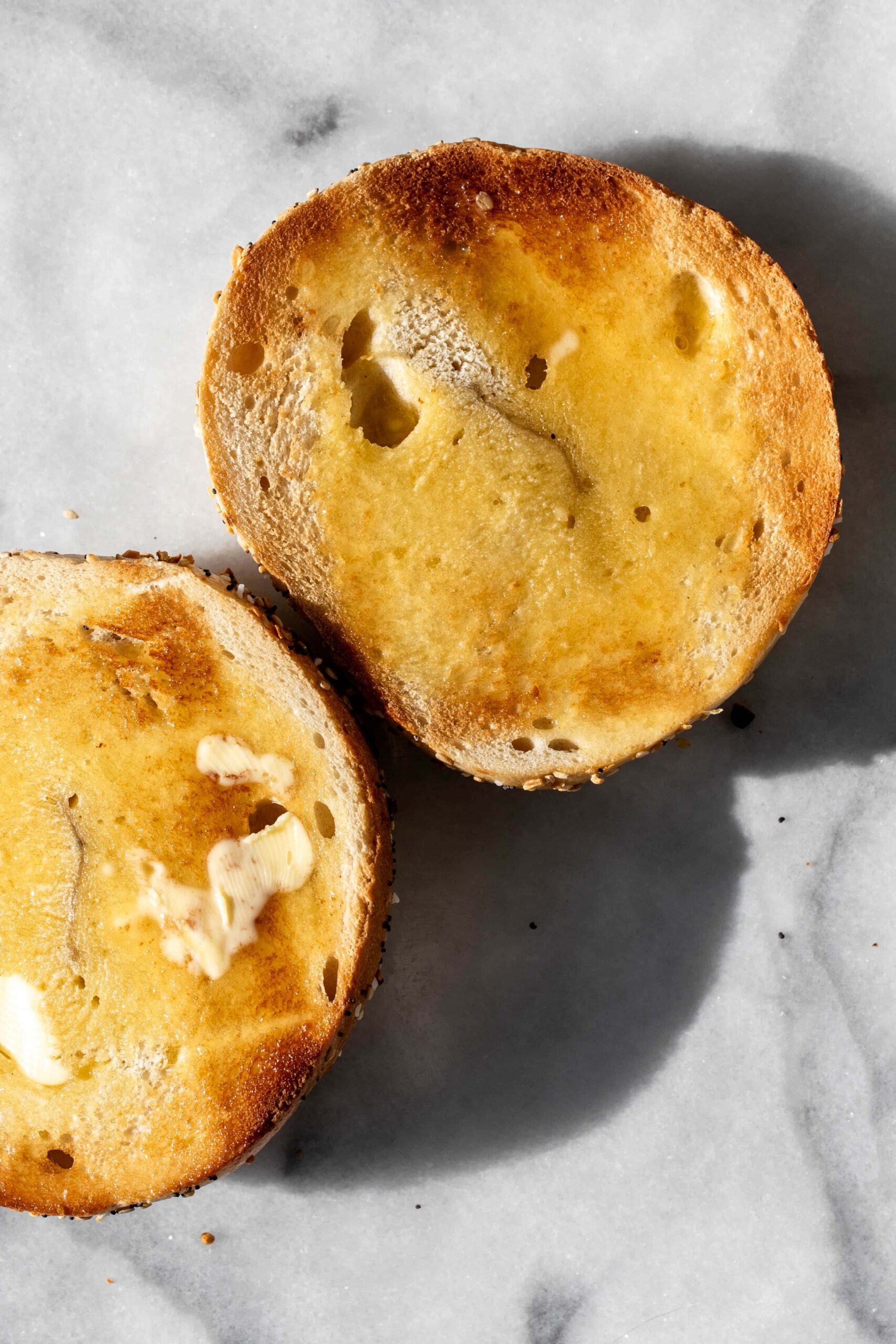 buttered toasted bagel cut in half.