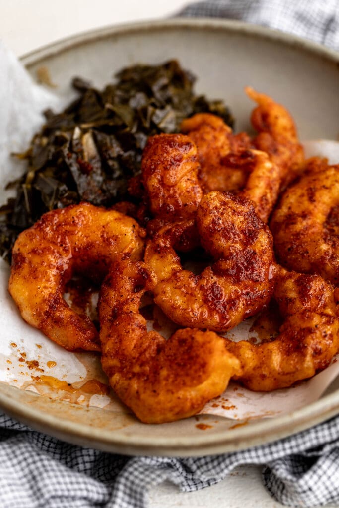 served Nashville-Style Hot Fried Shrimp with collard greens.