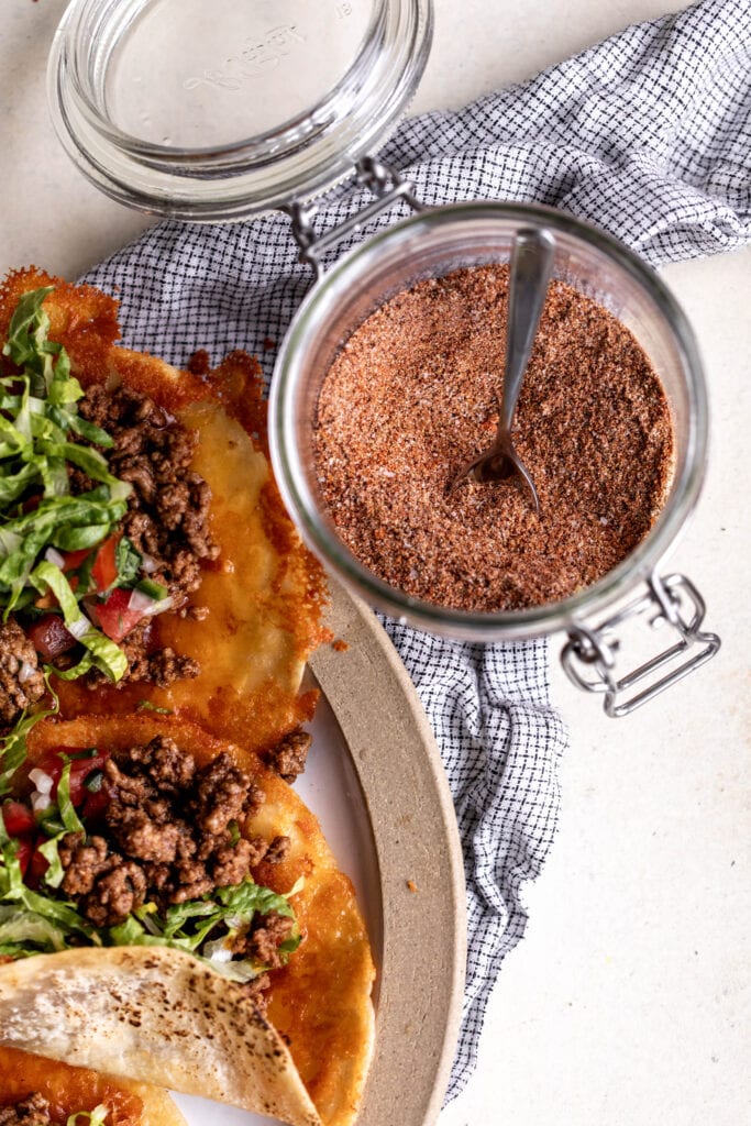 The best homemade taco seasoning mixed in glass bowl.