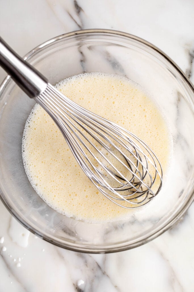 mixed dry and wet ingredients for Best Banana Pancakes.