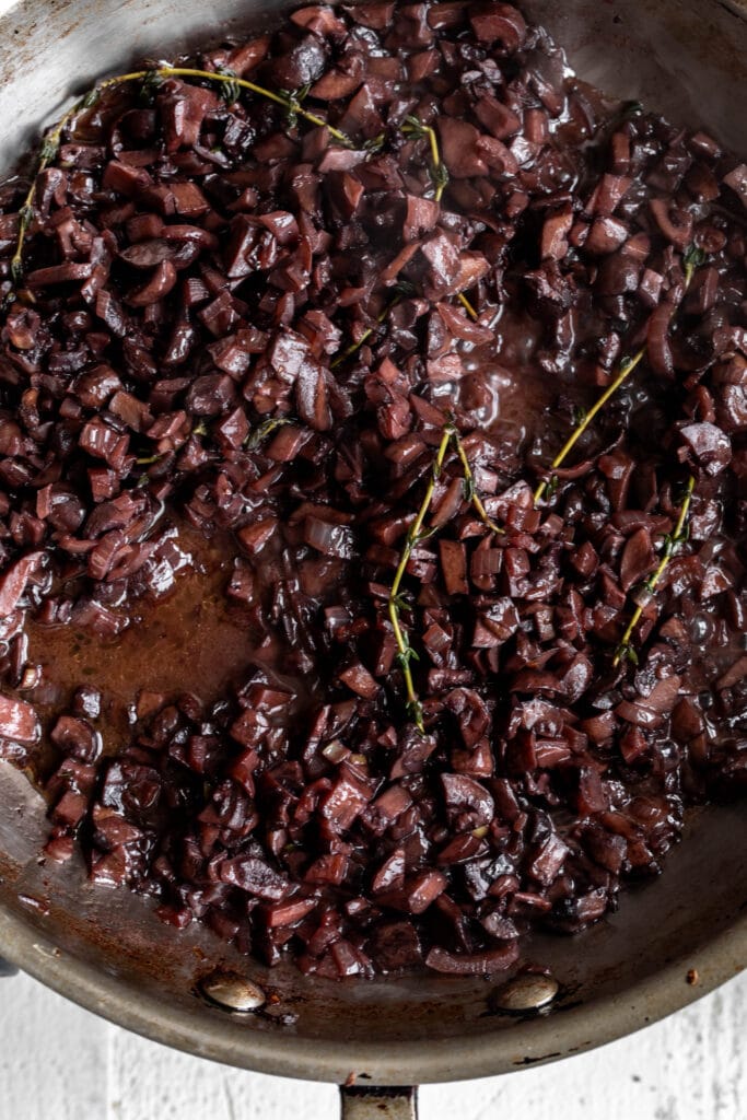 sautéed mushrooms with red wine reduced in pan.