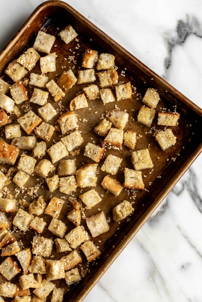 sesame croutons on baking sheet.