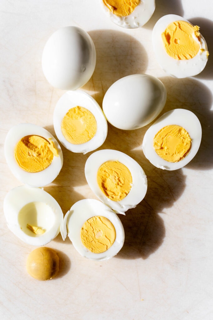 halved hard boiled eggs with yellow yolks.