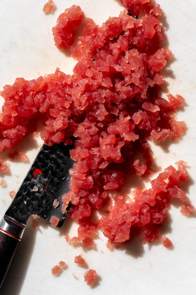 Chopped tuna with chef\'s knife.