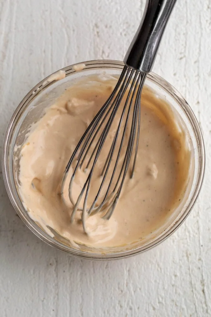 Aioli for Chicken Pot Pie Croquettes with small whisk.
