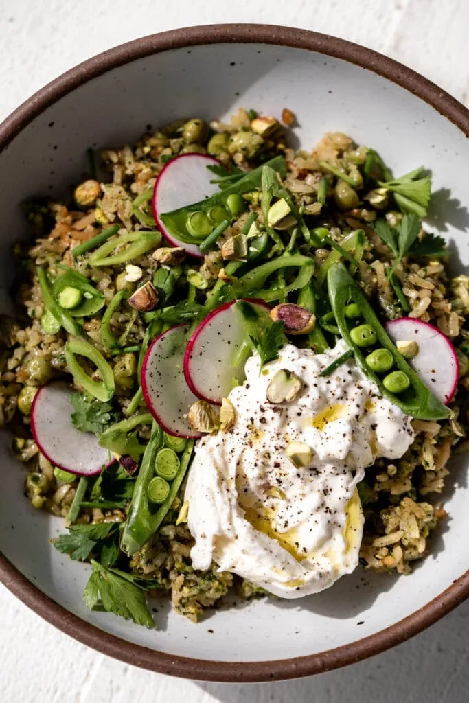 Assembled Spring Rice Pilaf with Pistachio Pesto on plate. 